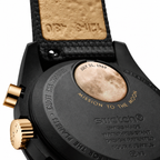 Omega x Swatch MoonSwatch black and gold watch - white background