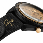Omega x Swatch MoonSwatch black and gold watch - white background